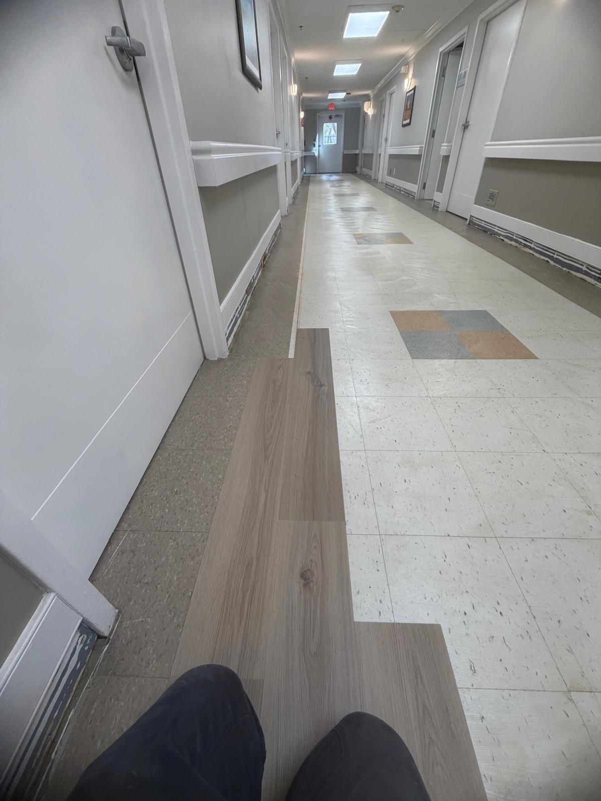 Transition detail between old tile and new plank flooring