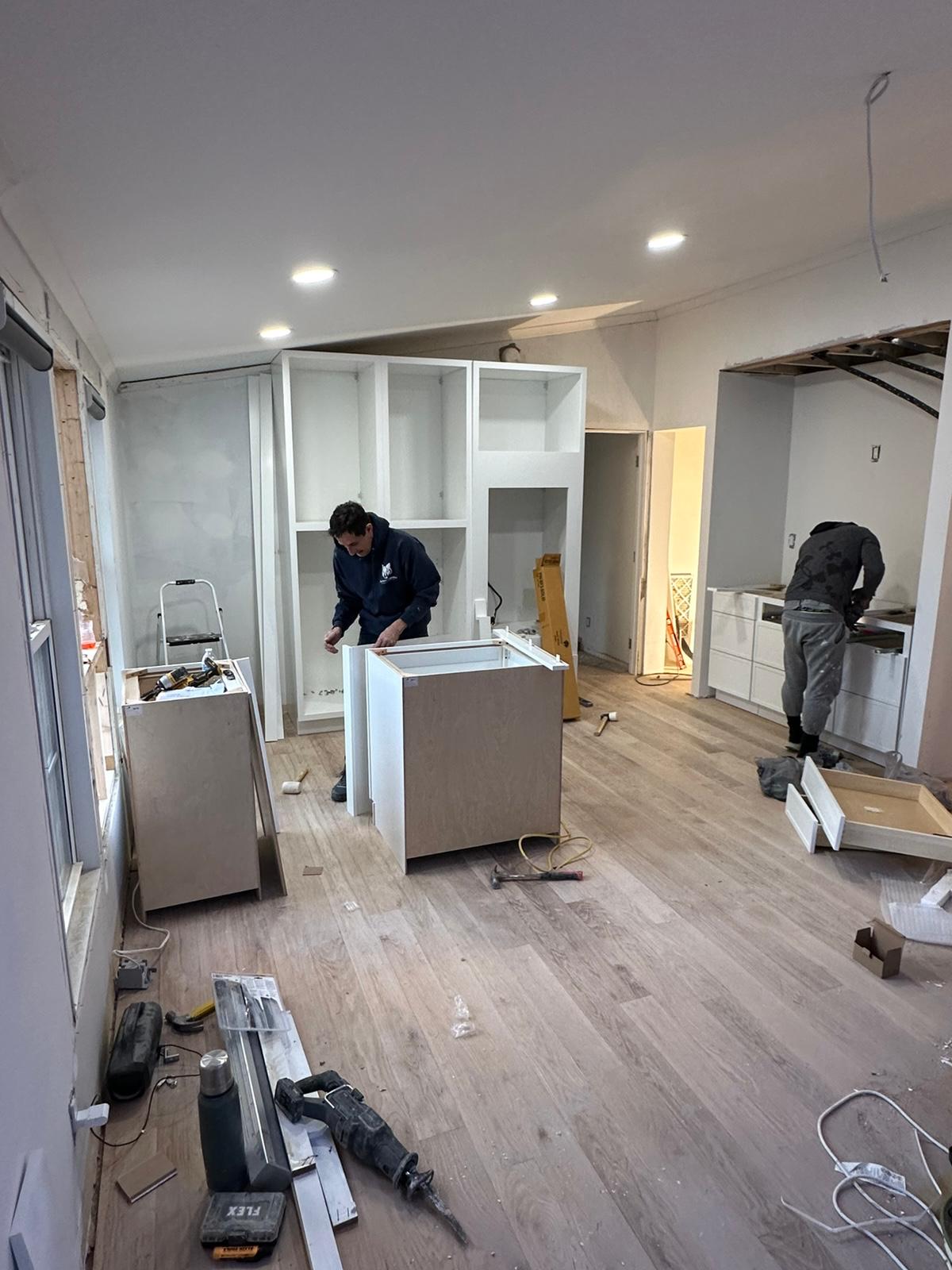 Kitchen remodel in progress with new cabinetry installation
