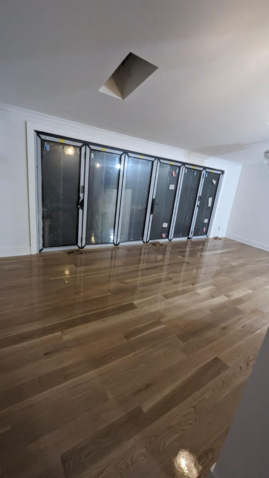 Refinished hardwood floor with glossy satin finish