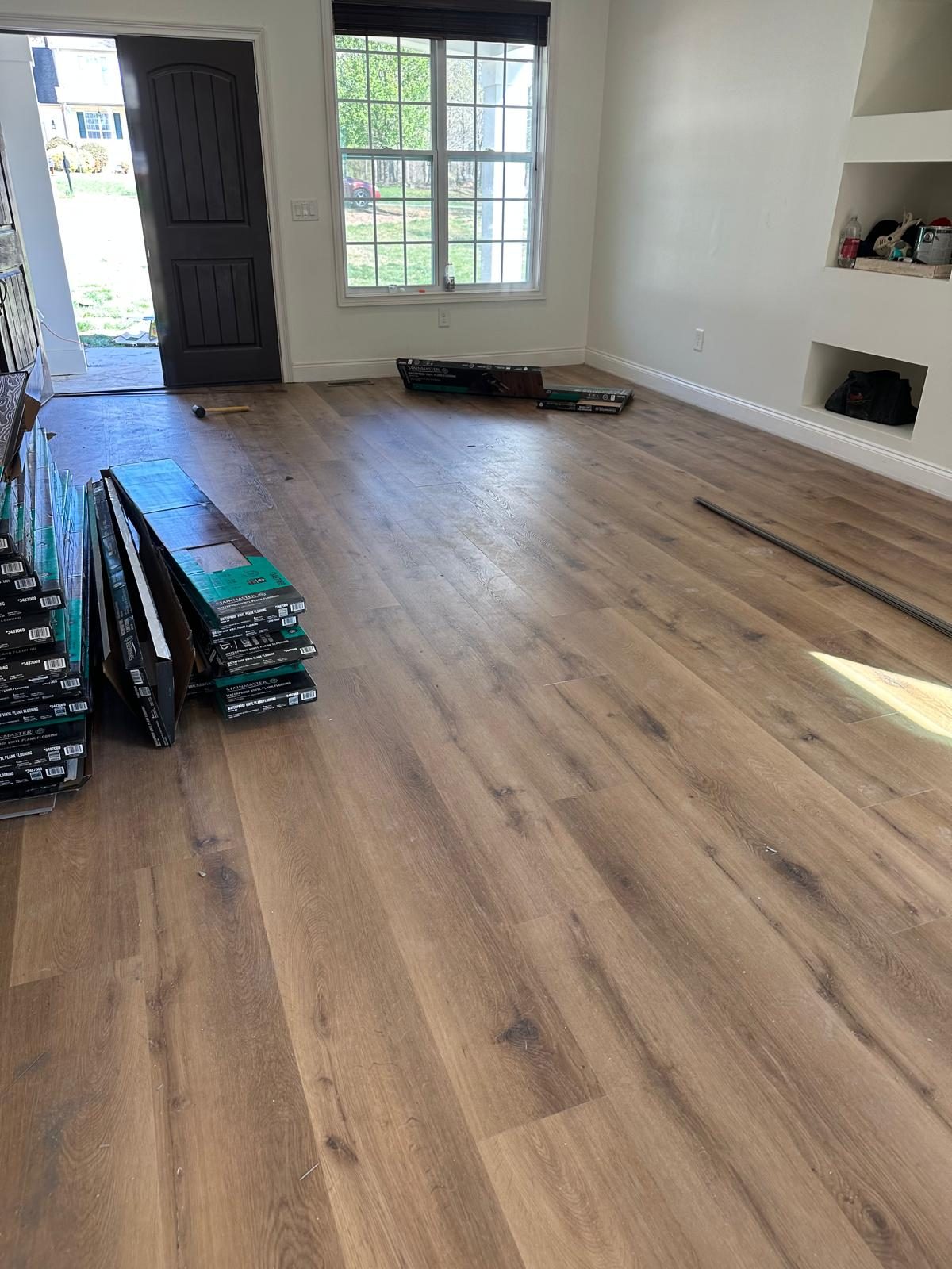 New luxury vinyl plank installation in a residential living room