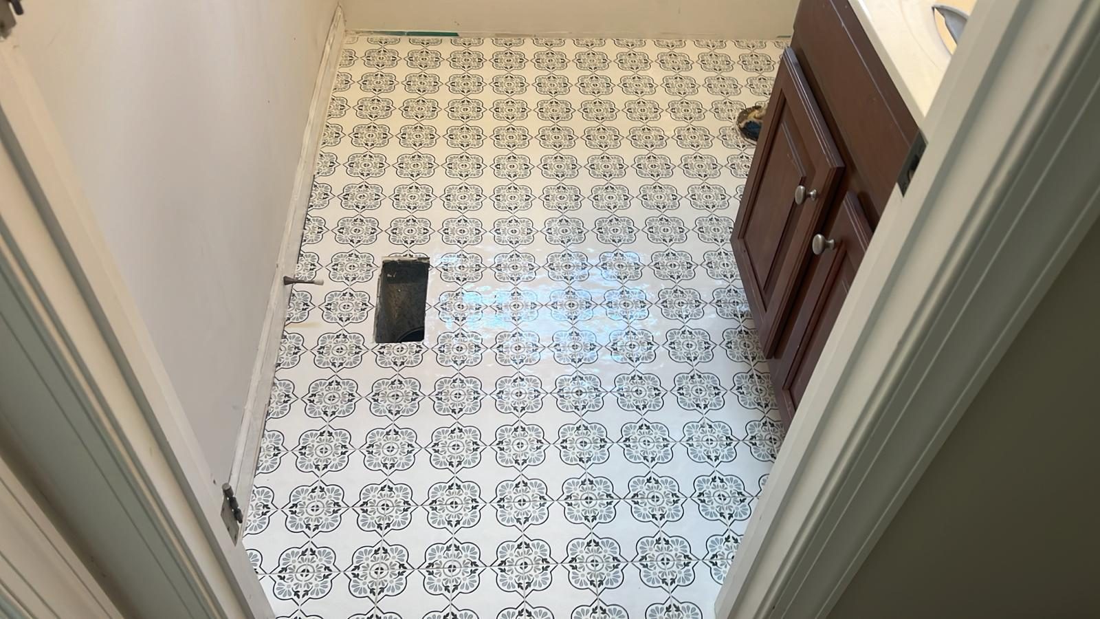 Patterned encaustic tile floor installation